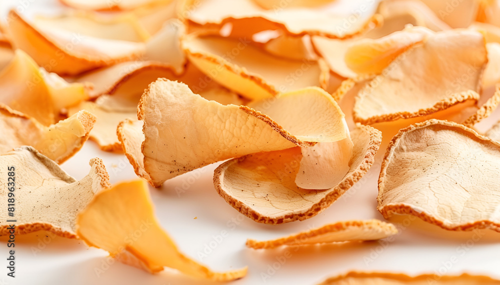 Many dry orange peels on white table, closeup Many dry orange peels on white table, closeup
