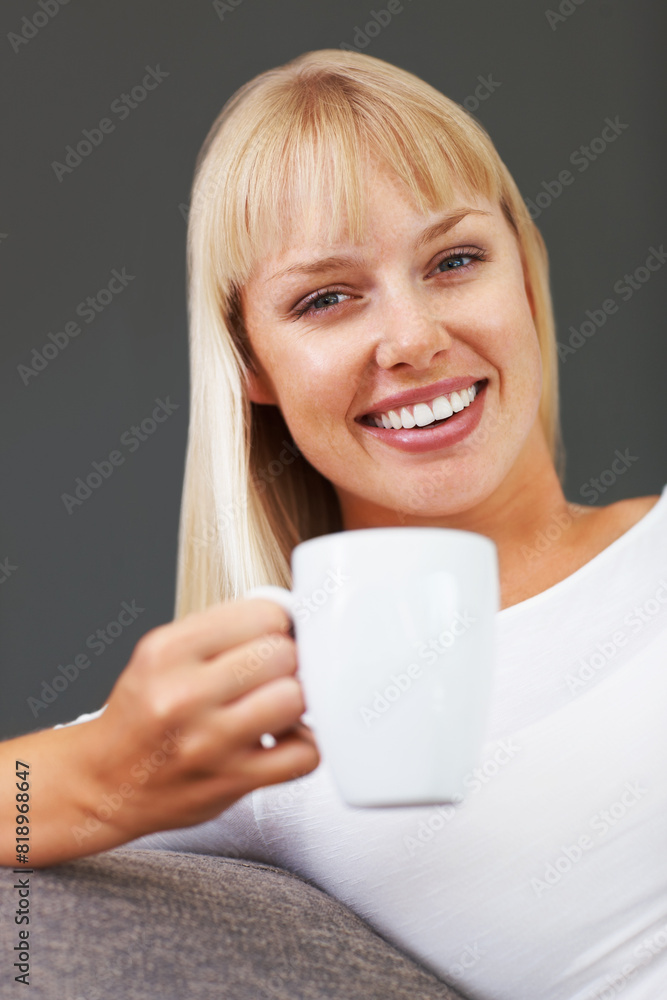 Portrait, coffee and woman on sofa with mug for happiness, relax or morning routine in living room. Smile, drink and person with hot beverage for enjoyment, stress relief or weekend break in home Portrait, coffee and woman on sofa with mug for happiness, relax or morning routine in living room. Smile, drink and person with hot beverage for enjoyment, stress relief or weekend break in home