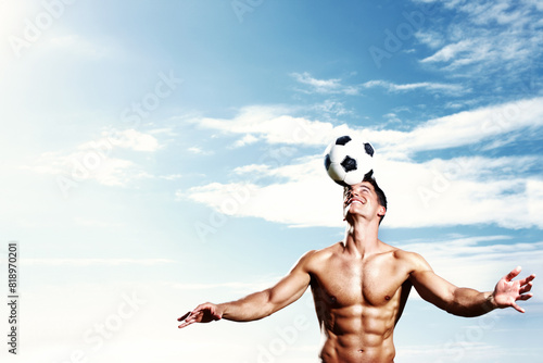 Soccer ball, blue sky and man for practice, head and fitness for action and football athlete. Summer, blue sky and sports for male person and fit body for wellness and heath, training and game field photo