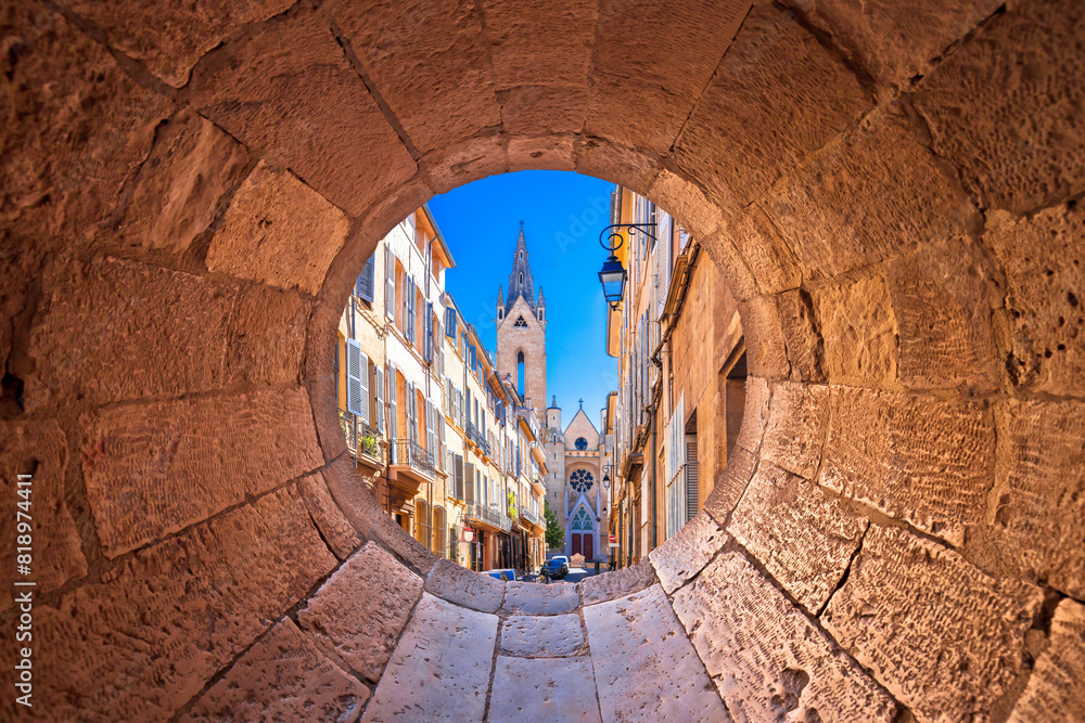 Aix En Provence scenic alley and church view through stone window