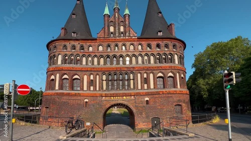 Holstein Gate or Holstentor Gate in historical center ancient city of Lubeck, Germany August 12, 2023. High quality 4k footage
