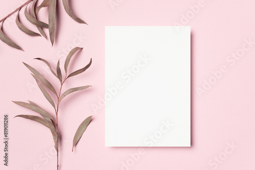 Blank greeting or invitation card mockup with copy space for card design on pink background