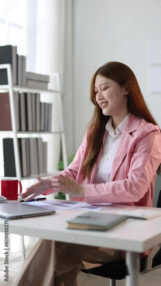 Happy Asian businesswoman doing stretches to relax after long hours of sitting in the office. Happy Asian businesswoman doing stretches to relax after long hours of sitting in the office.