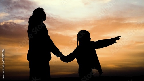 silhouette woman mother child kid sunset happy family, maternal presence trust, mother child interaction, protective maternal silhouette, supportive parent scene, sunset motherly comfort, family