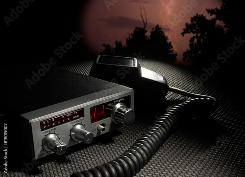 CB radio on channel 11 with lightning behind