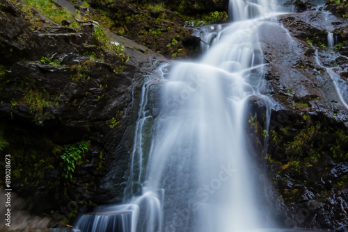 Waterfall. Majestic waterfall. Panoramic beautiful deep forest waterfall. Fantasy landscape with waterfalls  panorama. Waterfall in the forest