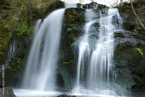 Waterfall. Majestic waterfall. Panoramic beautiful deep forest waterfall. Fantasy landscape with waterfalls  panorama. Waterfall in the forest