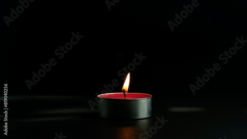 An aromatherapy candle that is lit to provide fragrance and feel relaxed.