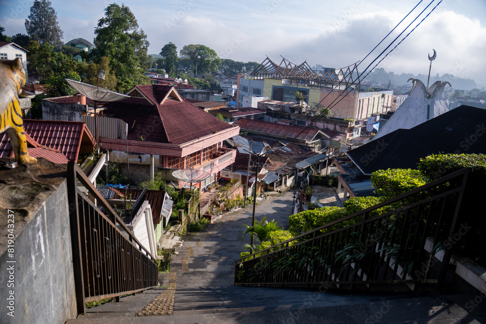 Naklejka premium One of the famous stairways in Bukit Tinggi is called Janjang 40. It consists of 40 steps and was built by the Dutch in 1908 to connect Pasar Atas and Pasar Bawah 