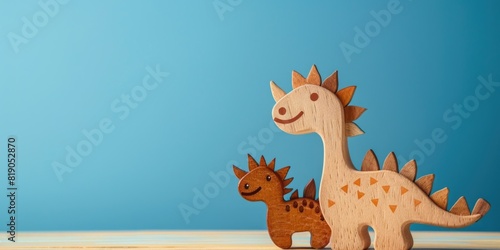 Cute wood dinosaurs isolated with copy space