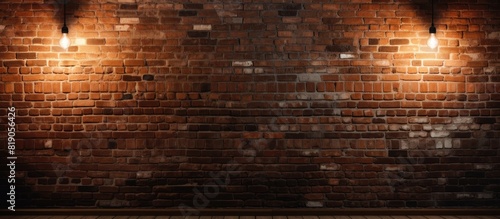 The brick wall background is beautifully lit by a hanging spotlight creating a perfect spot for a copy space image