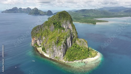 Top shot over Pinagbuyutan island, amazing nature, rocky landscape, pristine beach and blue sea of El Nido, Bacuit bay, Palawan, Philippines 4K photo