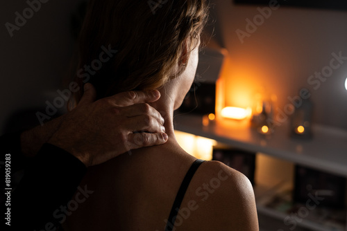 Close-up of male hands doing lymphatic drainage massage on a female neck.