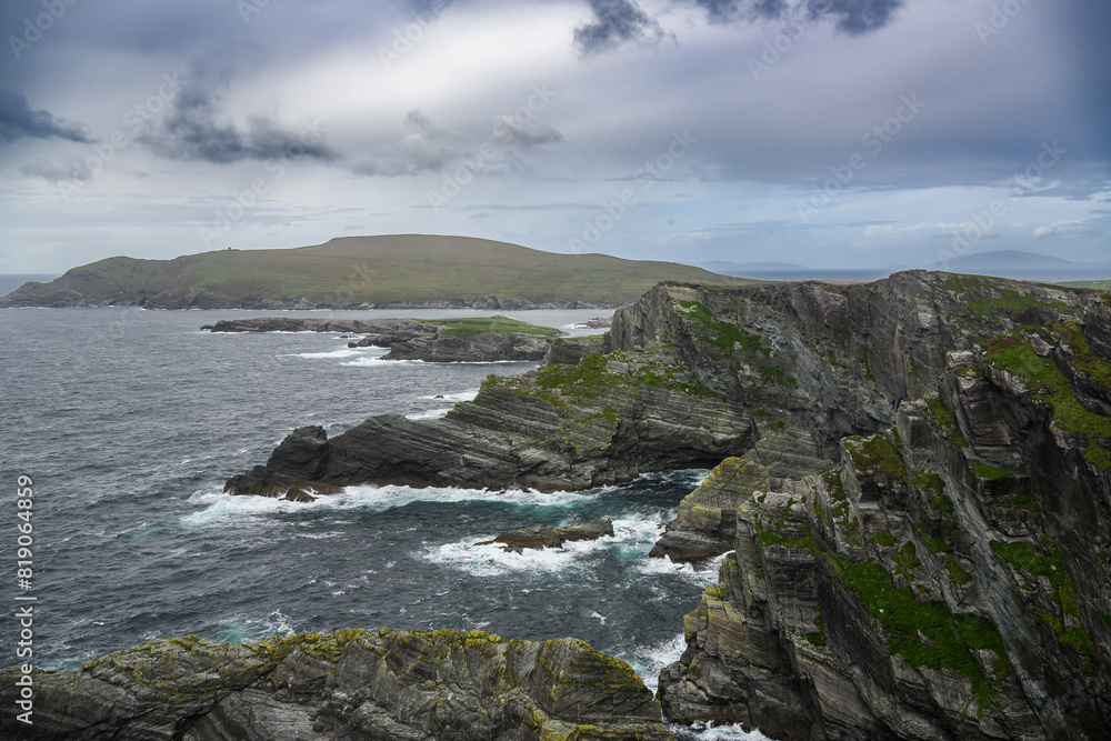 Large Body of Water Near Rocky Shore Large Body of Water Near Rocky Shore