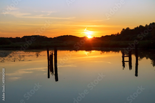 Sunset on the lake. Landscape with water body and sunset.
