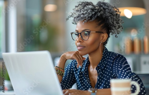 Woman in Glasses Working on Laptop