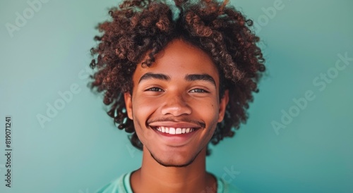 Smiling Black Man With Dreadlocks Against Blue Background