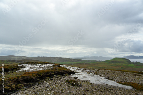 Small Stream Flowing Through Rocky Field
