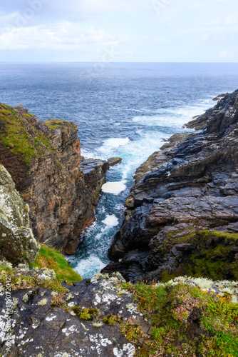 Rocky Cliff Overlooking Body of Water © Matteo