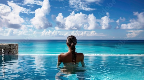 Woman at luxury resort poolside