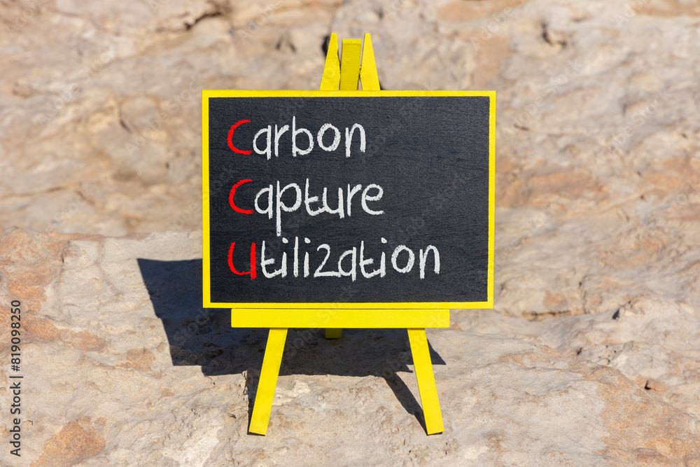 Fototapeta premium CCU Carbon capture utilization symbol. Concept words CCU Carbon capture utilization on beautiful blackboard Beautiful stone background Business ecological Carbon capture utilization concept Copy space