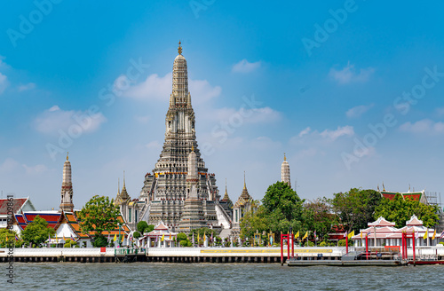 Wat Arun Temple along side of the Chao Praya River, one of the best landmark in Thailand for tourists and visitors.
