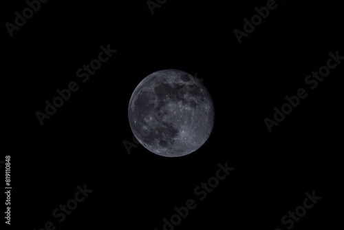Full Moon Illuminates Dark Night Sky
