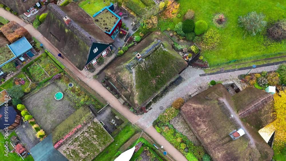 Aerial drone view of houses with thatched roofs of medieval fishing village Gothmund, Germany . High quality 4k footage Aerial drone view of houses with thatched roofs of medieval fishing village Gothmund, Germany . High quality 4k footage