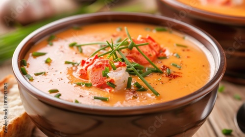 Lobster bisque soup garnished with chives