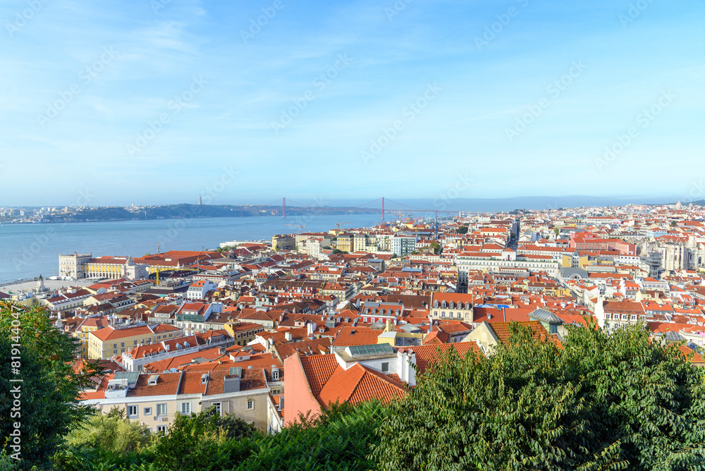 Obraz premium panoramic photo of the cityscape of Lisbon and the Tagus river on a sunny day