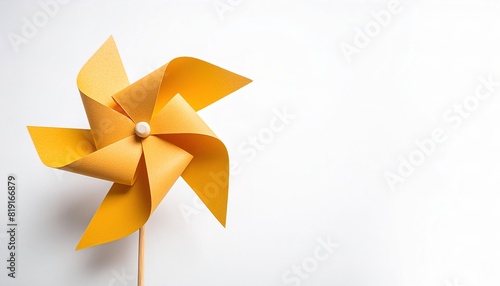 pinwheel or windmill paper origami isolated on white background simple starter craft for kids for weekend entertainment. ESG and Clean Energy Concept. Wind Turbine Paper into the Sky. Decrease Carbon