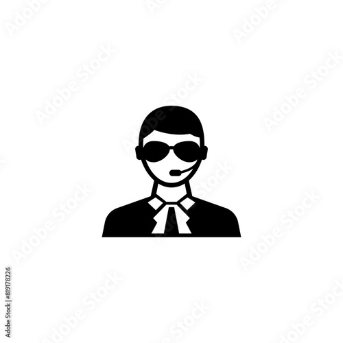 A minimalist black and white icon depicting the silhouette of a security guard or bodyguard wearing sunglasses, representing protection, surveillance and safety-related services.