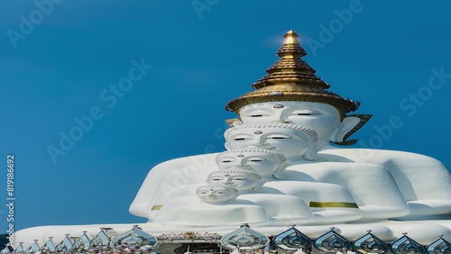 The big white Buddha five statue,Phetchabun is one of the top Thailand famous temples with a huge five white jade buddhas layered statue,Wat Phra That Pha Kaew, Phetchabun,Five white Buddha statue. photo