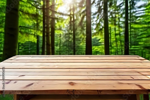 A wooden table in front of trees