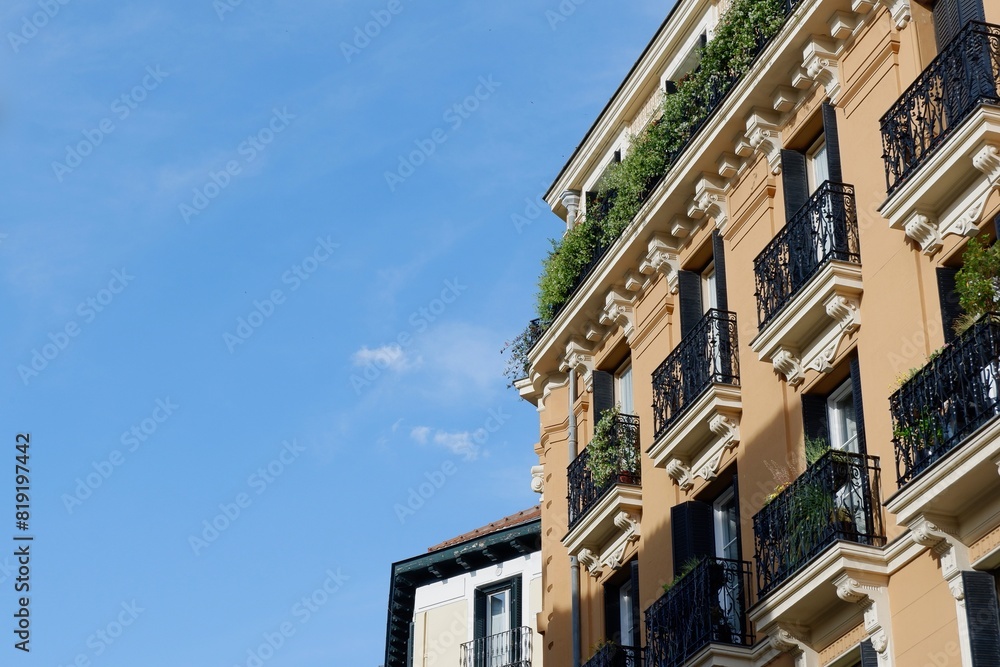 Corner of classical rich buildings with vivid greenery downtown madrid, spain. spanish vintage architecture Corner of classical rich buildings with vivid greenery downtown madrid, spain. spanish vintage architecture