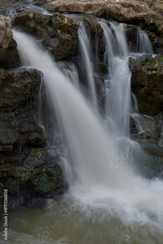 Water flowing between the rocks  beautiful water panorama  waterfall