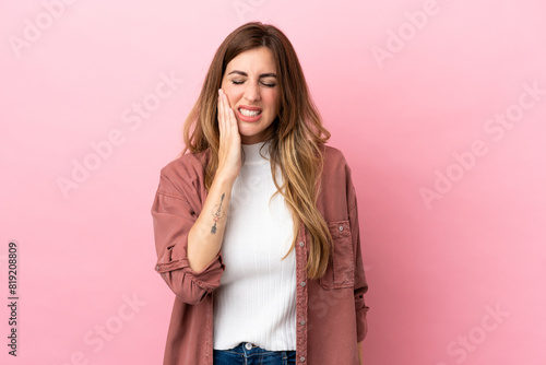 Caucasian woman isolated on pink background with toothache