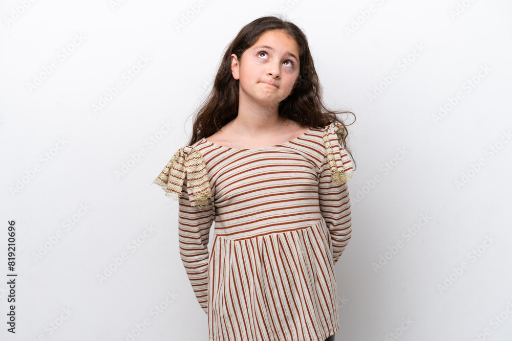 Little girl isolated on white background and looking up Little girl isolated on white background and looking up