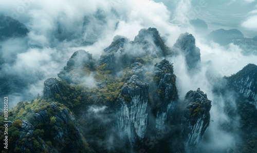 aerial view of beautiful rocky cliffs covered by the clouds. 