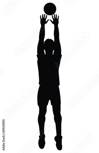 Black silhouette of a volleyball player who jumps straight with his hands raised high to catch or block the ball