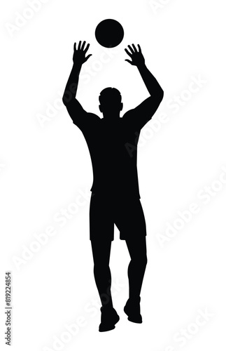 Black silhouette of a volleyball player from the back who jumps straight with his arms raised high to catch or block the ball
