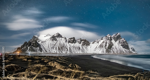 Stunning night view of snow-covered Vestrahorn mountains at Stokksnes beach, South East Iceland photo