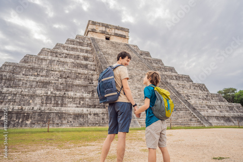 Father and son tourists observing the old pyramid and temple of the castle of the Mayan architecture known as Chichen Itza these are the ruins of this ancient pre-columbian civilization and part of