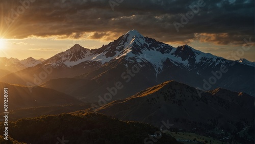 A view of a mountain range with the sun shining on it,.