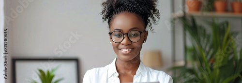 Young African American Woman Holding Tablet Computer