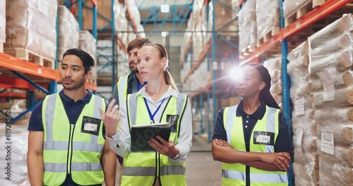 Warehouse, people and walking with tablet or discussion, inspection and construction team or conversation. Brainstorming, development and online inventory for project, storage depot and supervisor photo