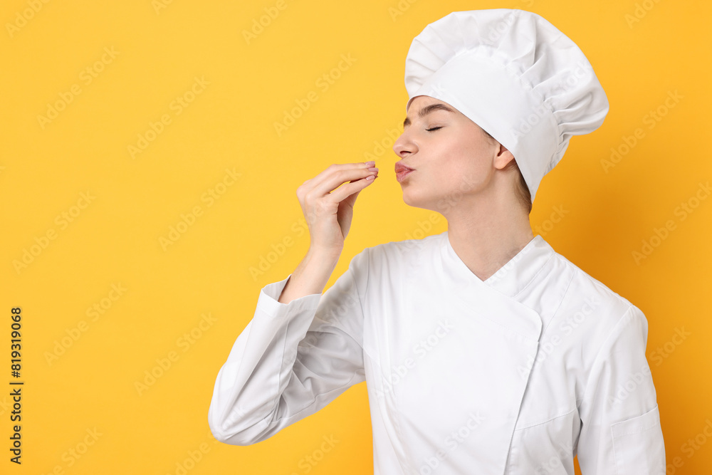 Professional chef showing perfect sign on yellow background. Space for text Professional chef showing perfect sign on yellow background. Space for text