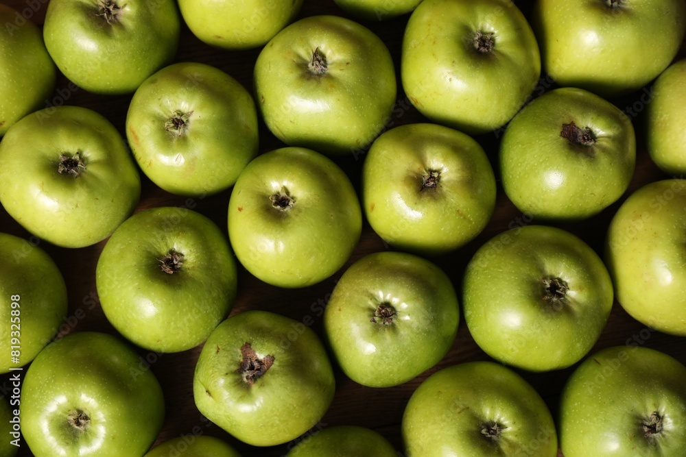 Fresh ripe green apples on wooden table, top view Fresh ripe green apples on wooden table, top view