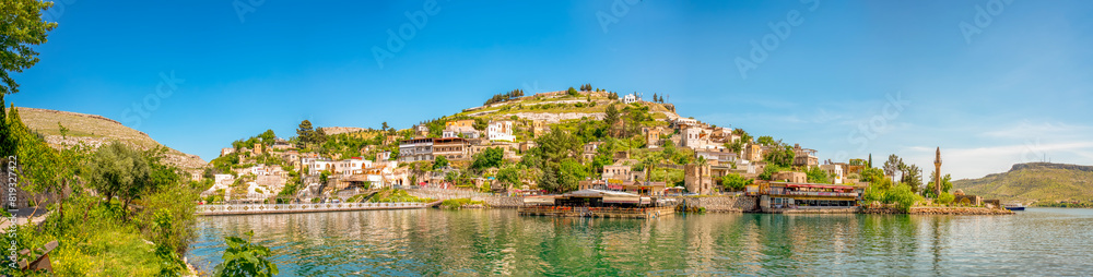 Halfeti village and its submerged minaret and Turkish flags of toursit boats sunken minaret in Halfeti - TURKEY. landscape photo Halfeti village and its submerged minaret and Turkish flags of toursit boats sunken minaret in Halfeti - TURKEY. landscape photo