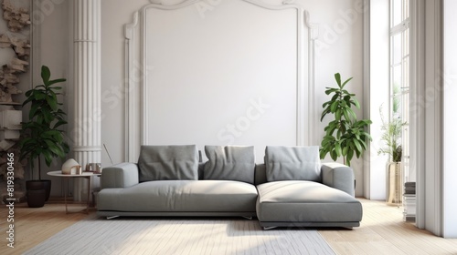 A minimally decorated living room with white walls  a gray couch  and plants by the windows. AIG51A.